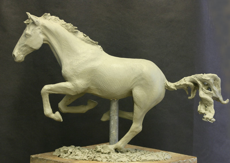 Galloping horse sculpture in clay