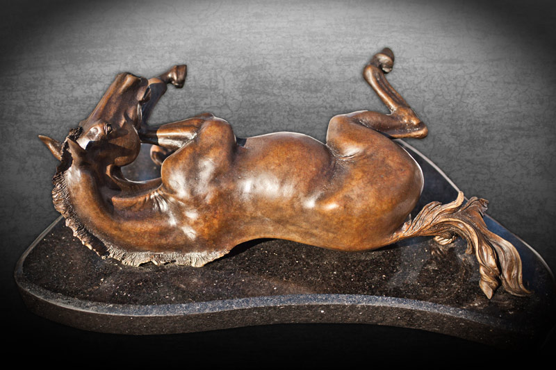 Bronze sculpture of rolling horse